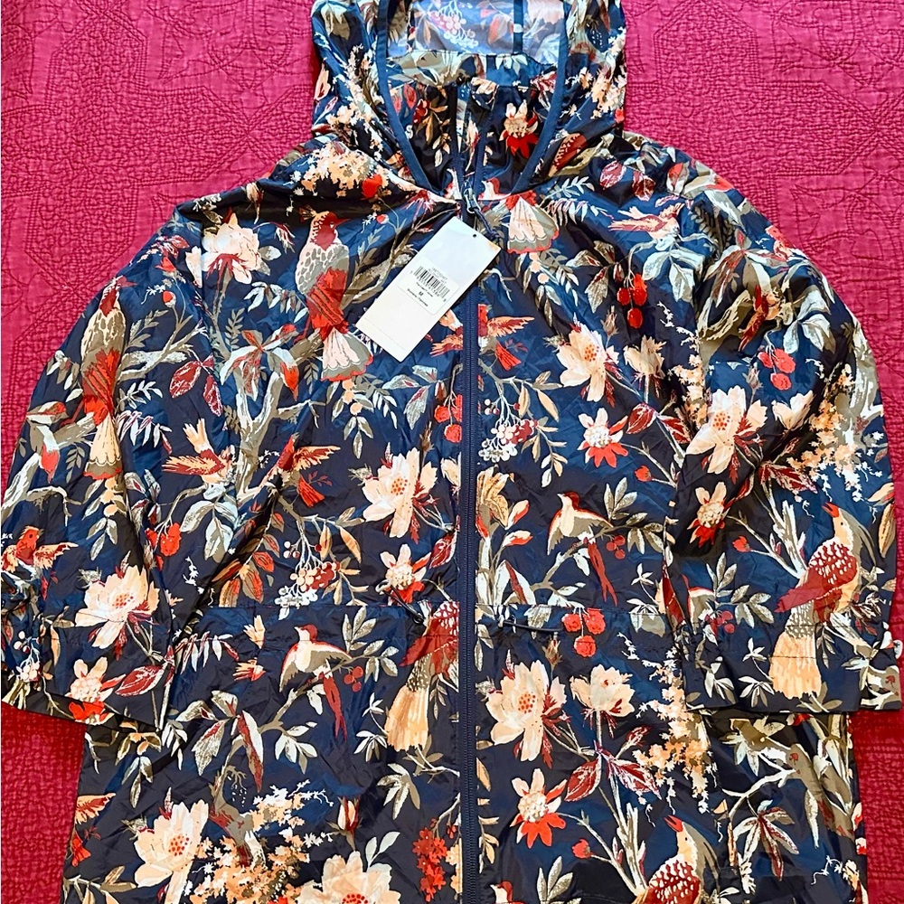 Columbia Poe Creek light weight packable rain jacket.